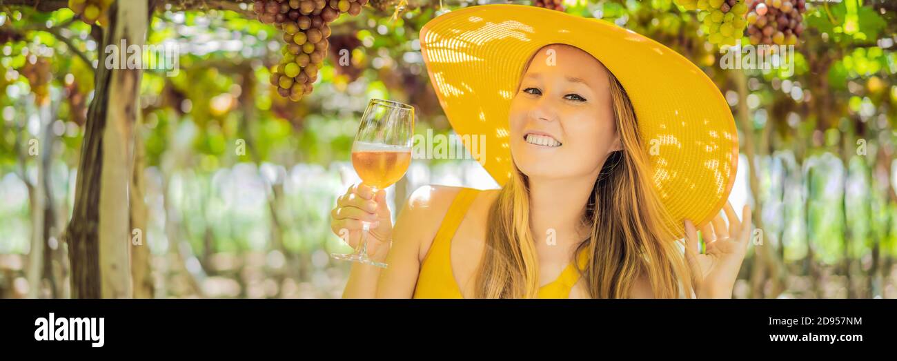 Woman with a glass of wine in the vineyard BANNER, LONG FORMAT Stock ...