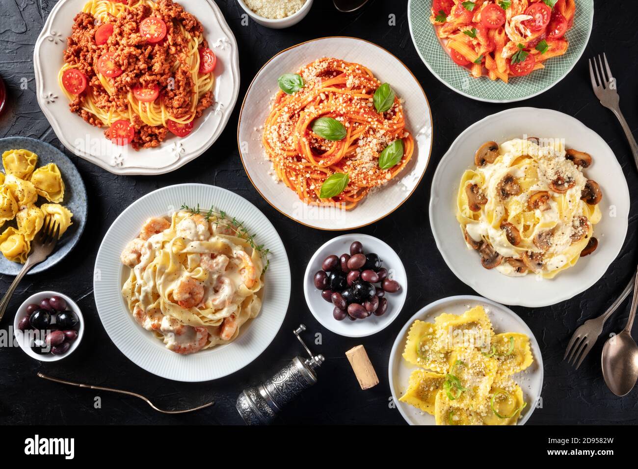 Pasta, many different varieties, shot from the top on a black background, Italian food flat lay Stock Photo