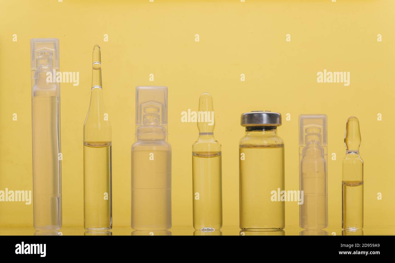 Glass medical ampoule vial for injection. Medicine is liquid sodium