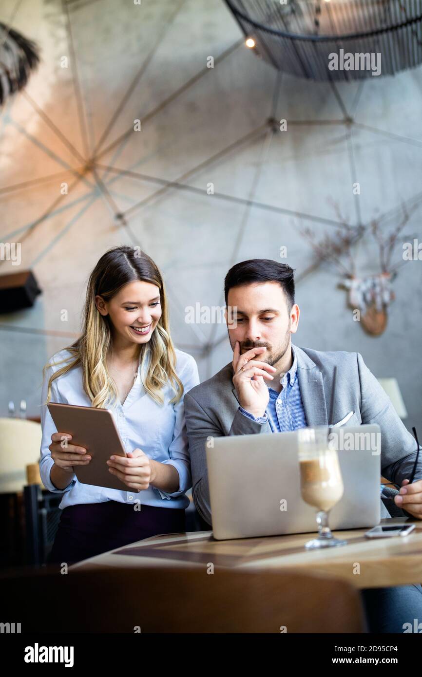 Business colleagues having conversation during coffee break Stock Photo