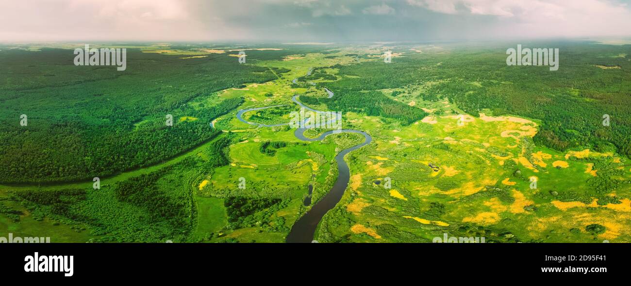 Aerial View Of Summer Curved River Landscape In Sunny Summer Day. Top View Of Beautiful European Nature From High Attitude In Summer Season. Drone Stock Photo