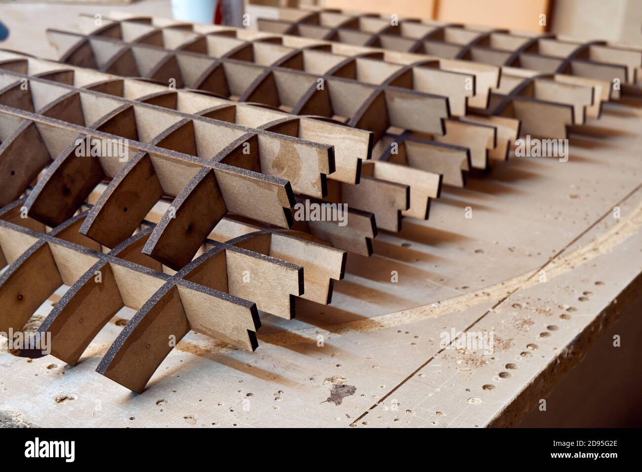 Joinery. MDF frames for bending plywood in workshop. Bend furniture manufacture Stock Photo