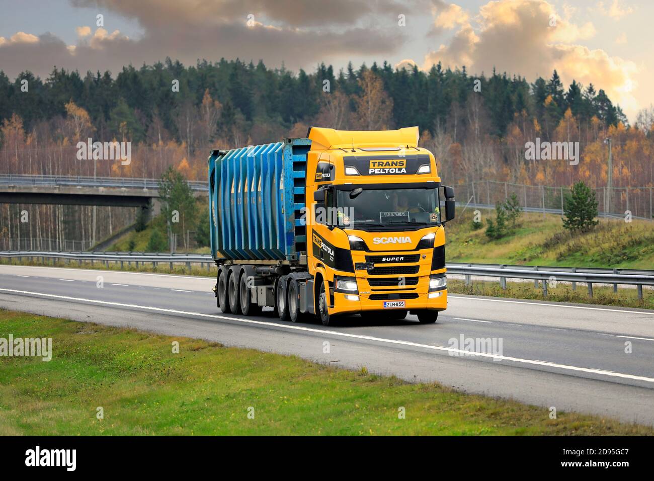 Next Generation Scania R500 truck of TransPeltola Oy hauls Bruhn Spedition cargo container on motorway in autumn. Salo, Finland. October 31, 2020. Stock Photo