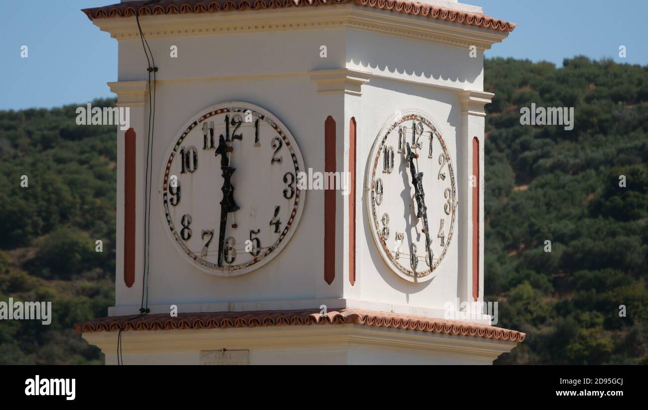Low angle shot of a clock on a tower in Crete, Greece Stock Photo Alamy