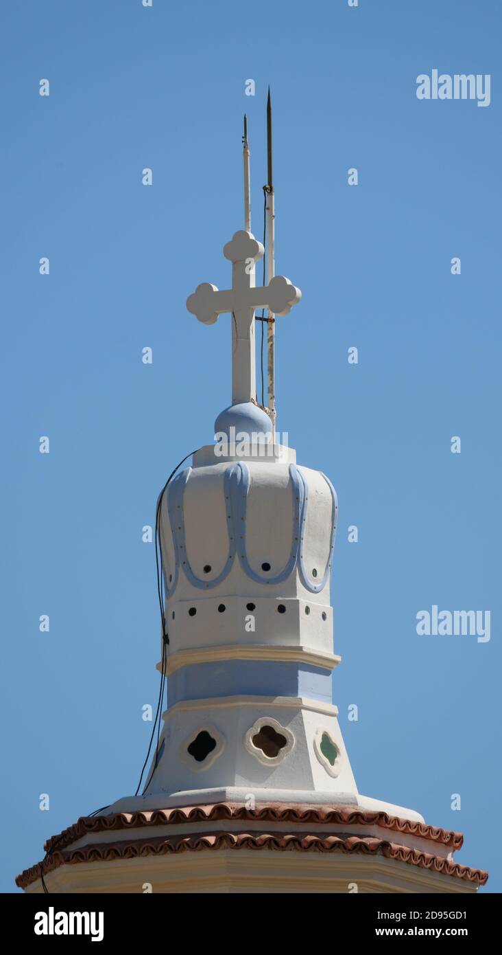 Vertical low angle shot of the cross on top of a church in Greece Stock ...