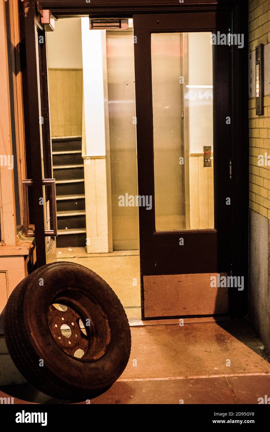 Tyre hold the door Stock Photo Alamy