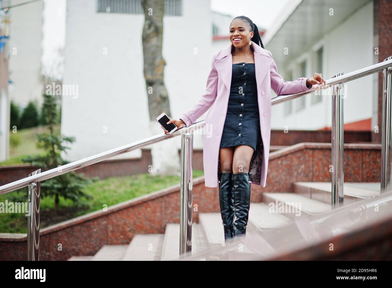 Young stylish beautiful african american woman in street, wearing ...