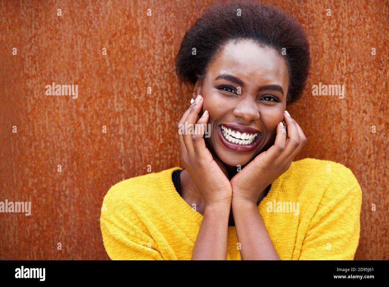 Close up portrait of happy african american woman laughing against ...