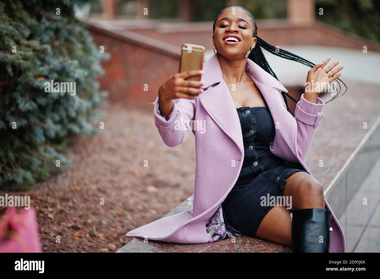 Young stylish beautiful african american woman in street, wearing ...
