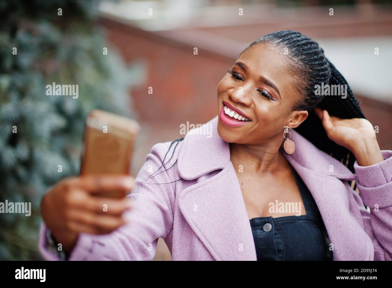 Young stylish beautiful african american woman in street, wearing ...