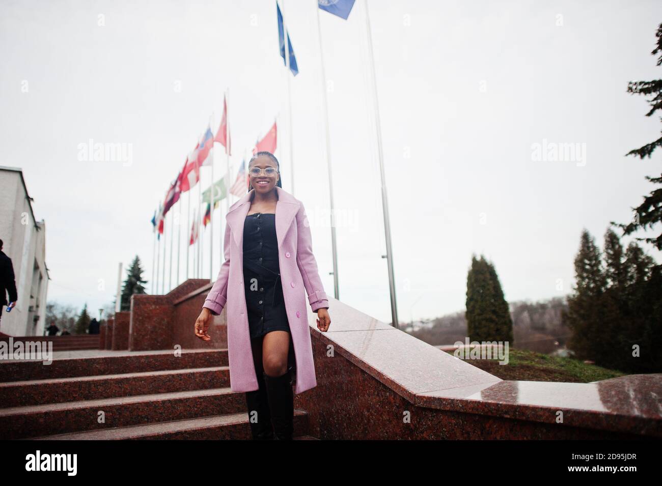 Young stylish beautiful african american woman in street, wearing ...