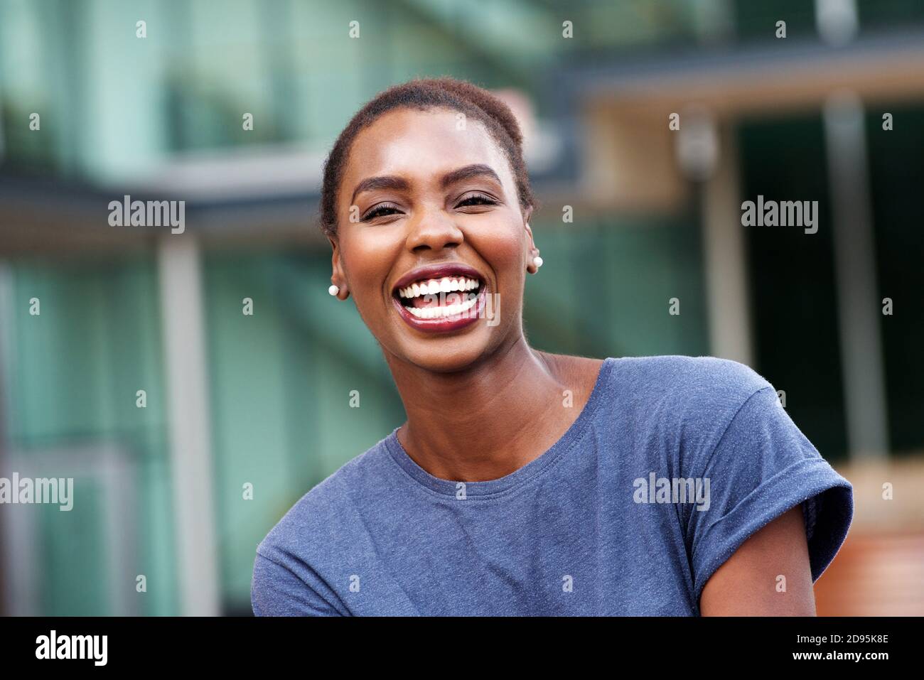 Close up portrait of beautiful young african american woman laughing ...
