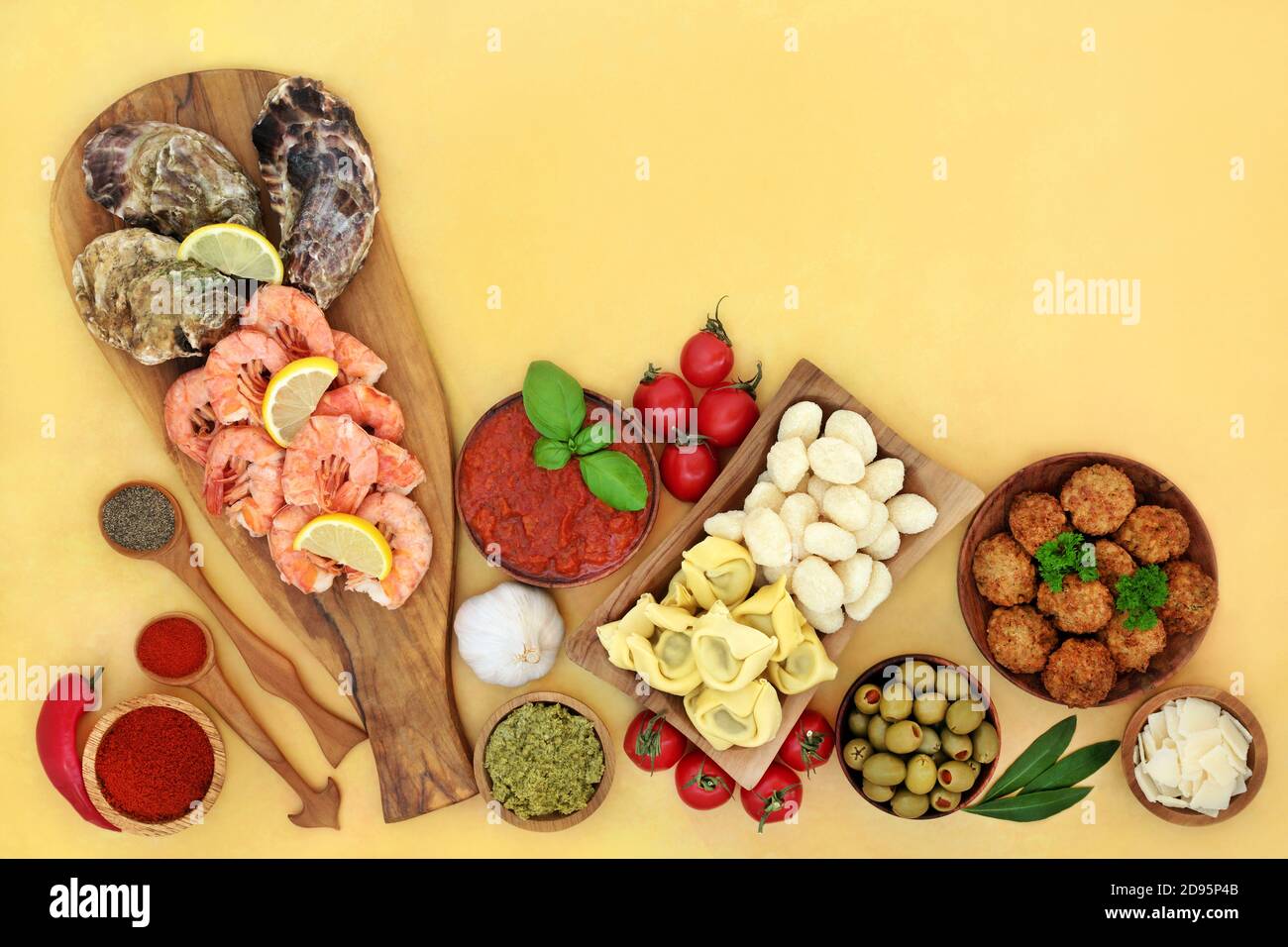 Italian sunshine food for a healthy balanced diet low in cholesterol, with seafood, pasta, vegetables, meatballs, cheese & sauces. High in antioxidant Stock Photo