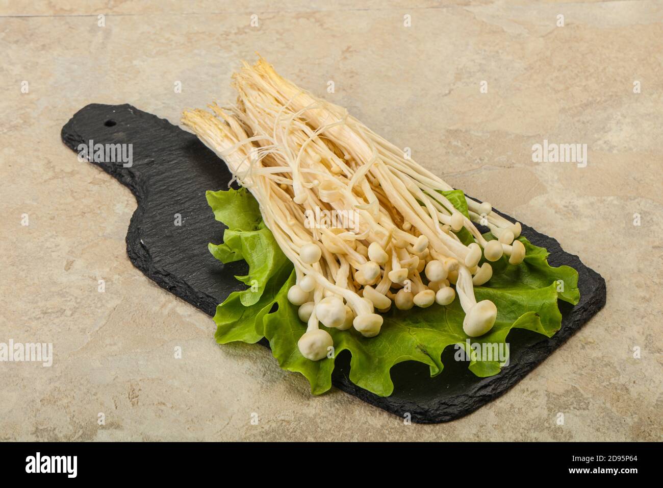 Raw Japanese Enoki mushrooms for cooking Stock Photo Alamy