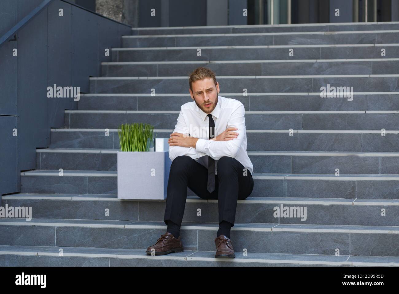 Businessman Being Kicked Out By His Employer Free Image and Photograph  26196001.