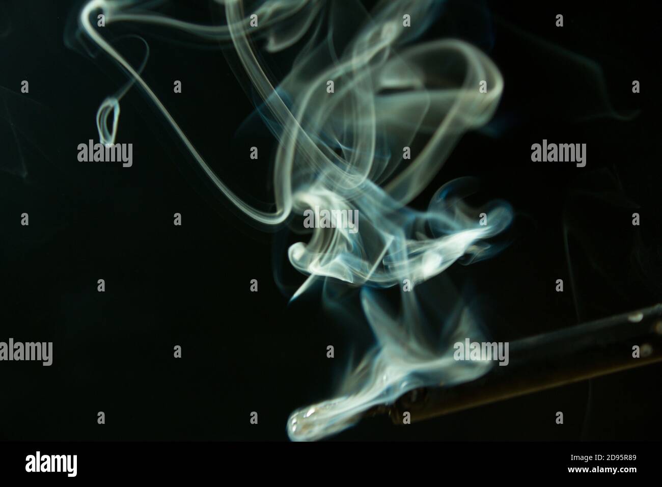 soldering iron with smoke from the sting of burning rosin . Photo on a