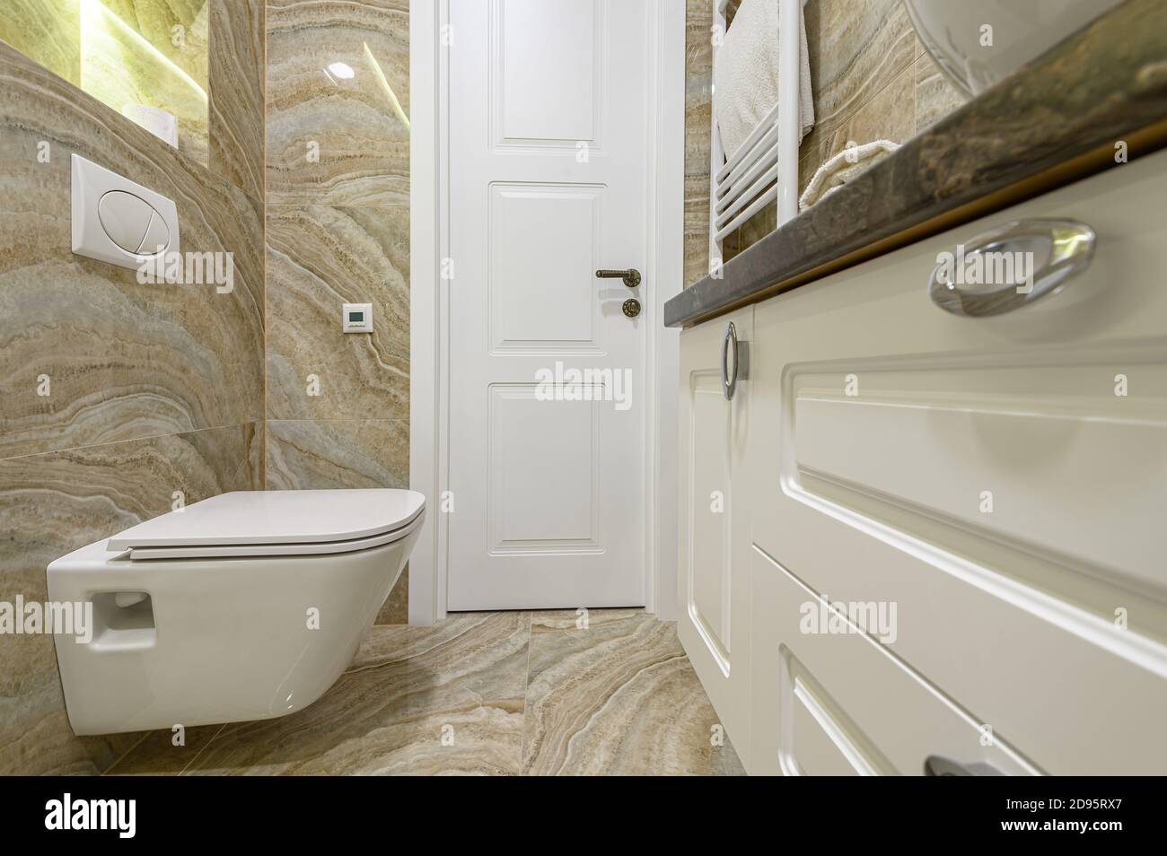 Luxury bathroom with beige marble tiles Stock Photo Alamy