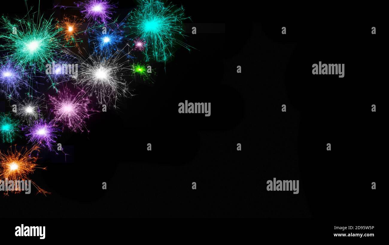 Wide angle Beautiful fireworks background. Frame of many multicolored fireworks isolated on black background Stock Photo