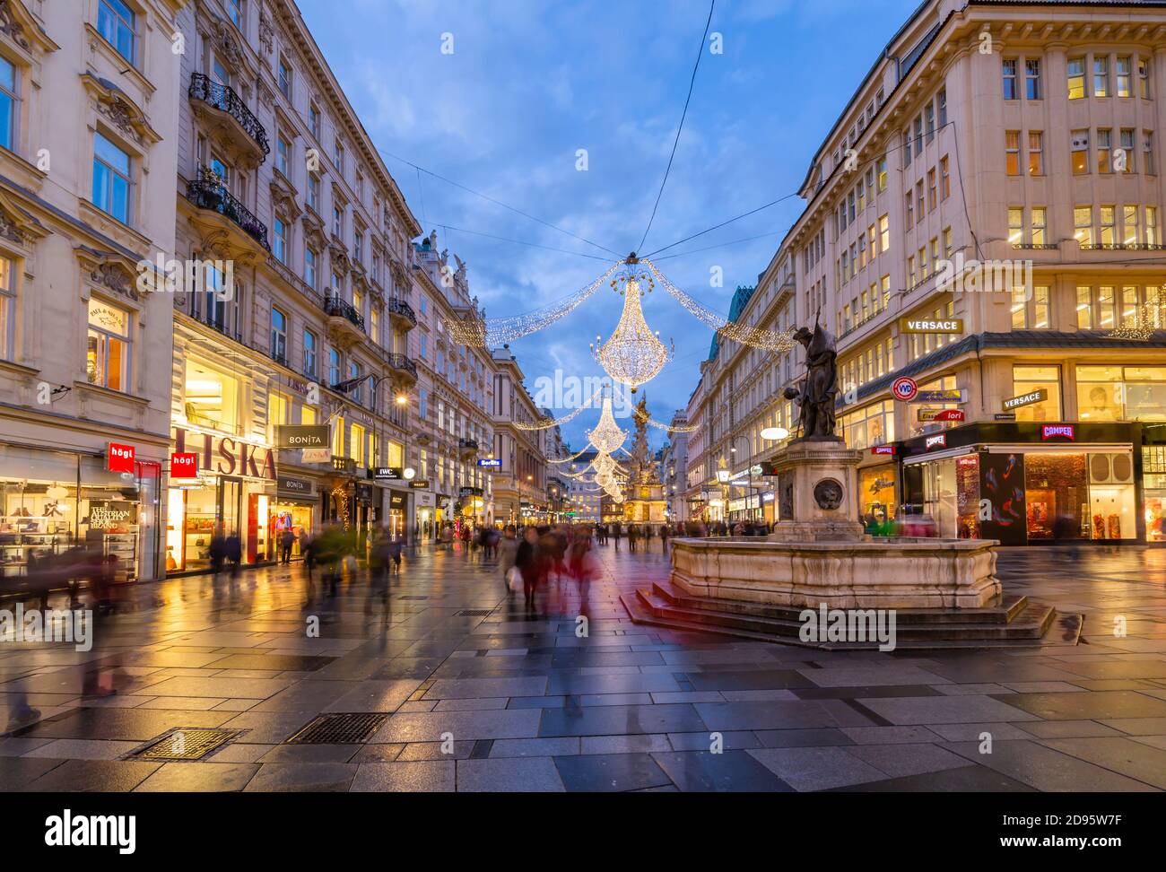 View of shops and statue on Graben at dusk, Vienna, Austria, Europe