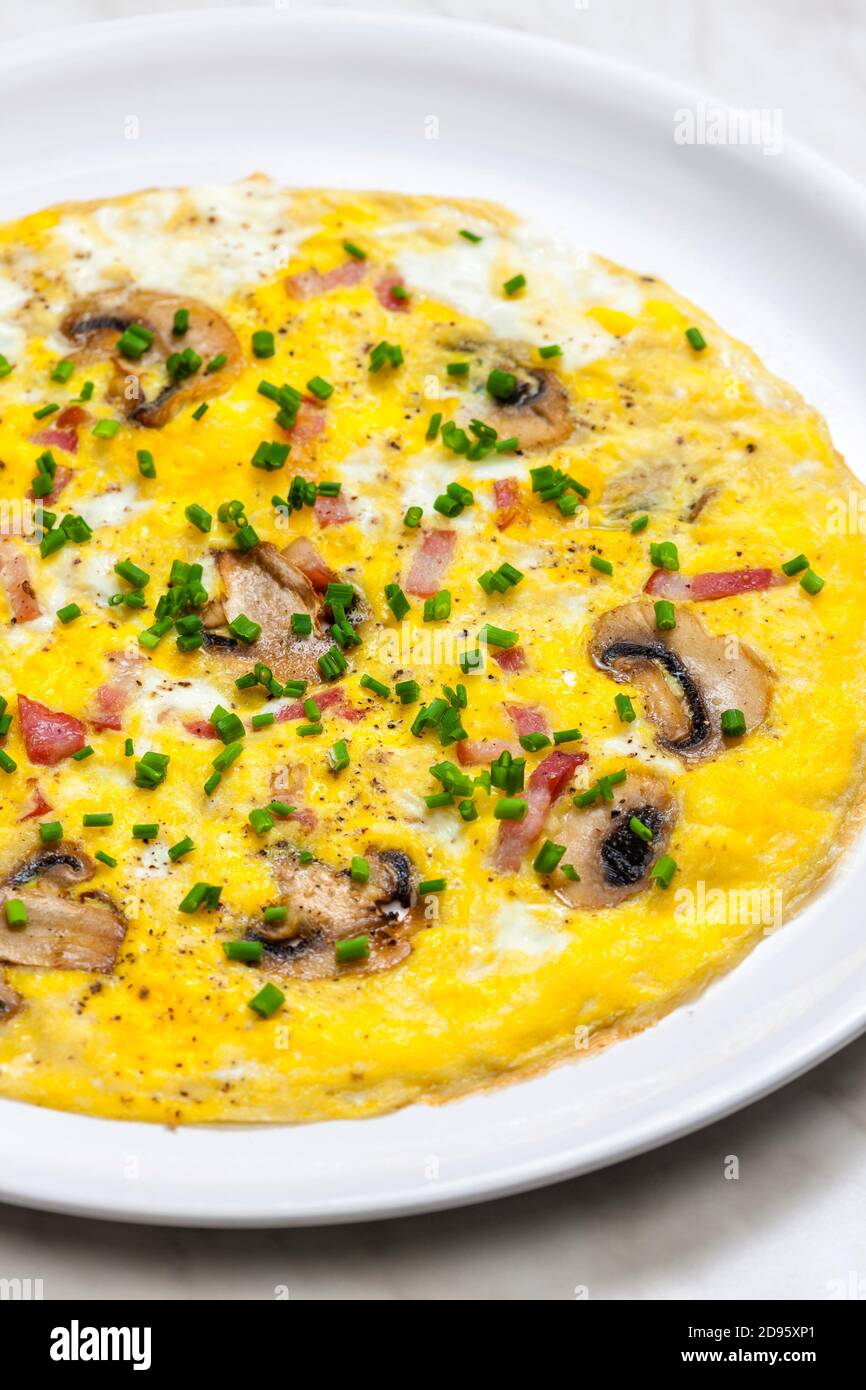 egg omelette with mushrooms and bacon Stock Photo - Alamy