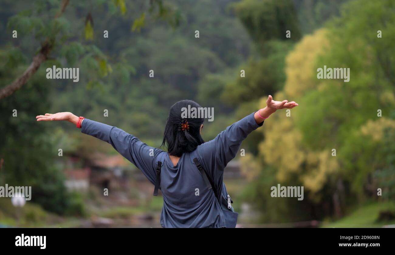 Asian girl Breathe in the fresh air on the mountain Stock Photo - Alamy