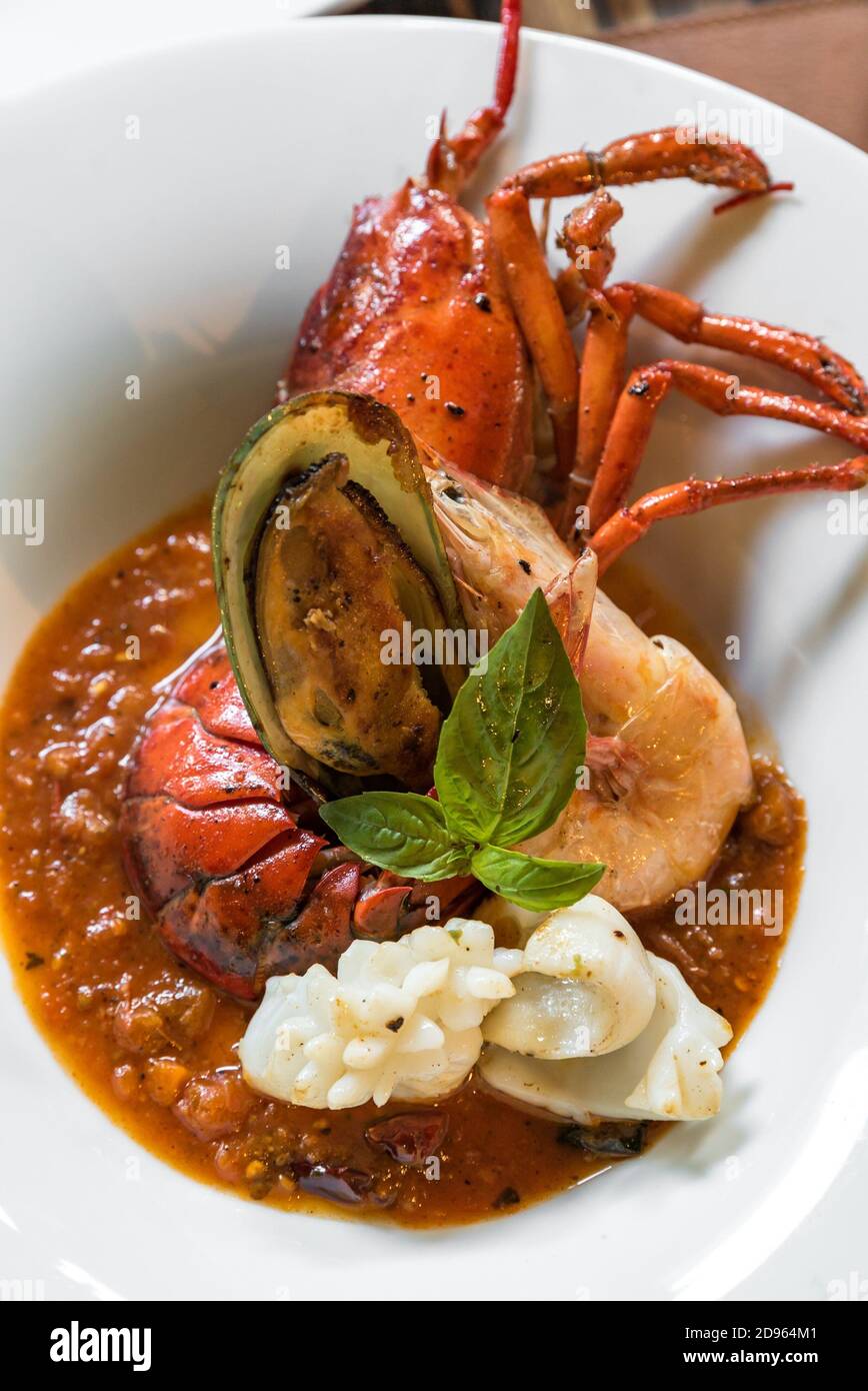 Pastis Grilled Halved Lobster Tails with mussel calamari Stock Photo
