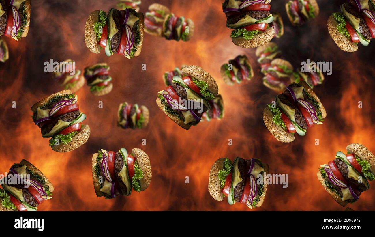 Hamburgers falling with smoke and burning fire in background. Fast food menu promo. Stock Photo