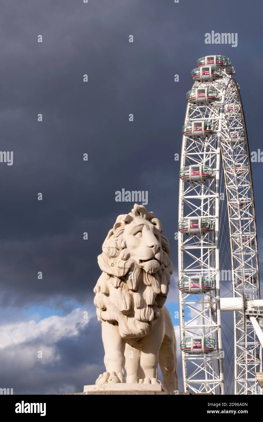 UK, London, Westminster, Westminster Bridge, the London Eye observation wheel, the South Bank coade stone lion statue, sculptor William Frederick Stock Photo
