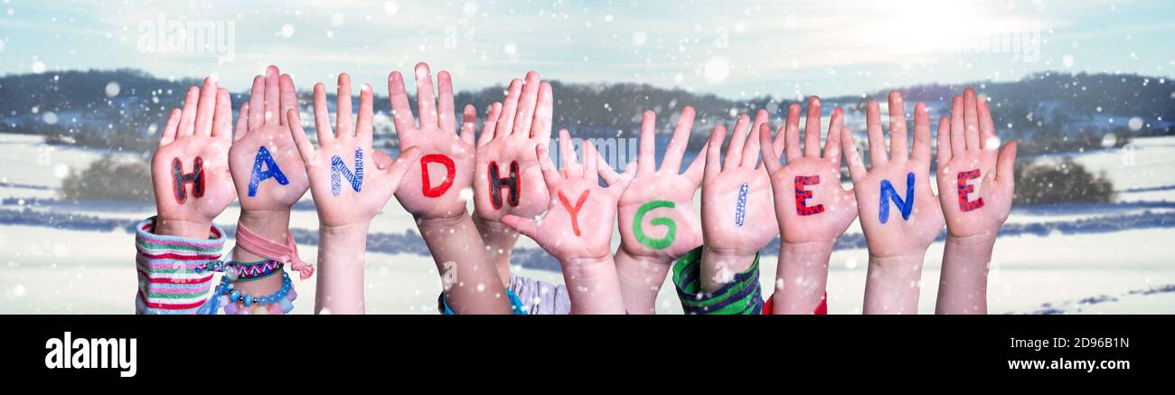 Kids Hands Holding Word Handhygiene Mean Hand Hygiene, Snowy Winter Background Stock Photo