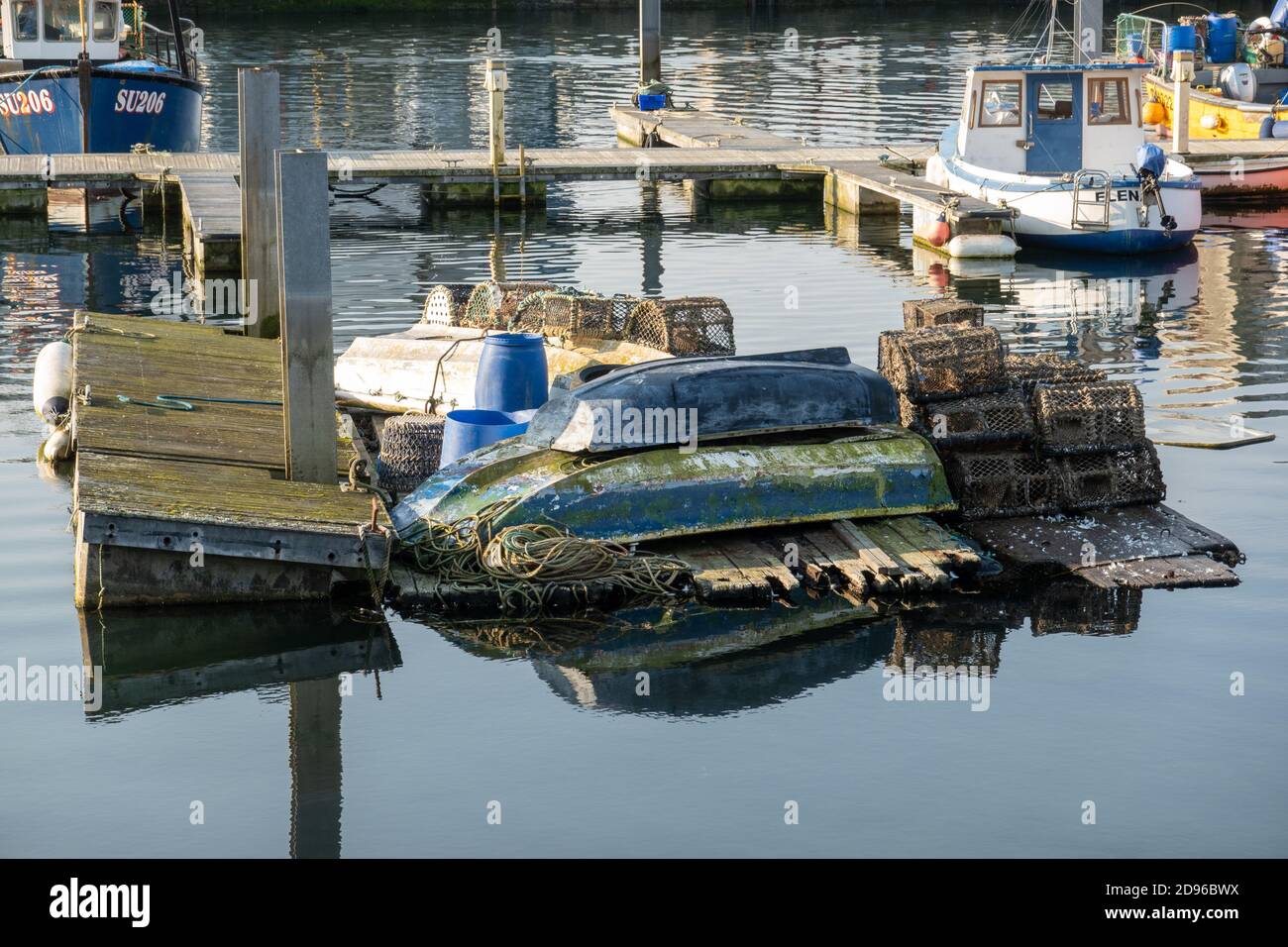 Pontoon containing fishing gear, lobster pots, crab pots, in Sutton  Harbour, Plymouth Stock Photo - Alamy