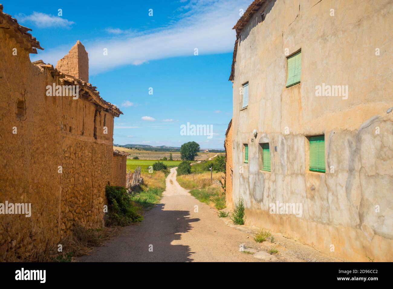 Facades of houses in ruins and path. Aguilera, Soria province, Castilla
