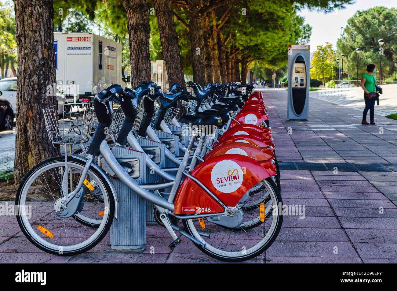 Selective focus on parked bicycles of the Sevici bicycles rental service Stock Photo