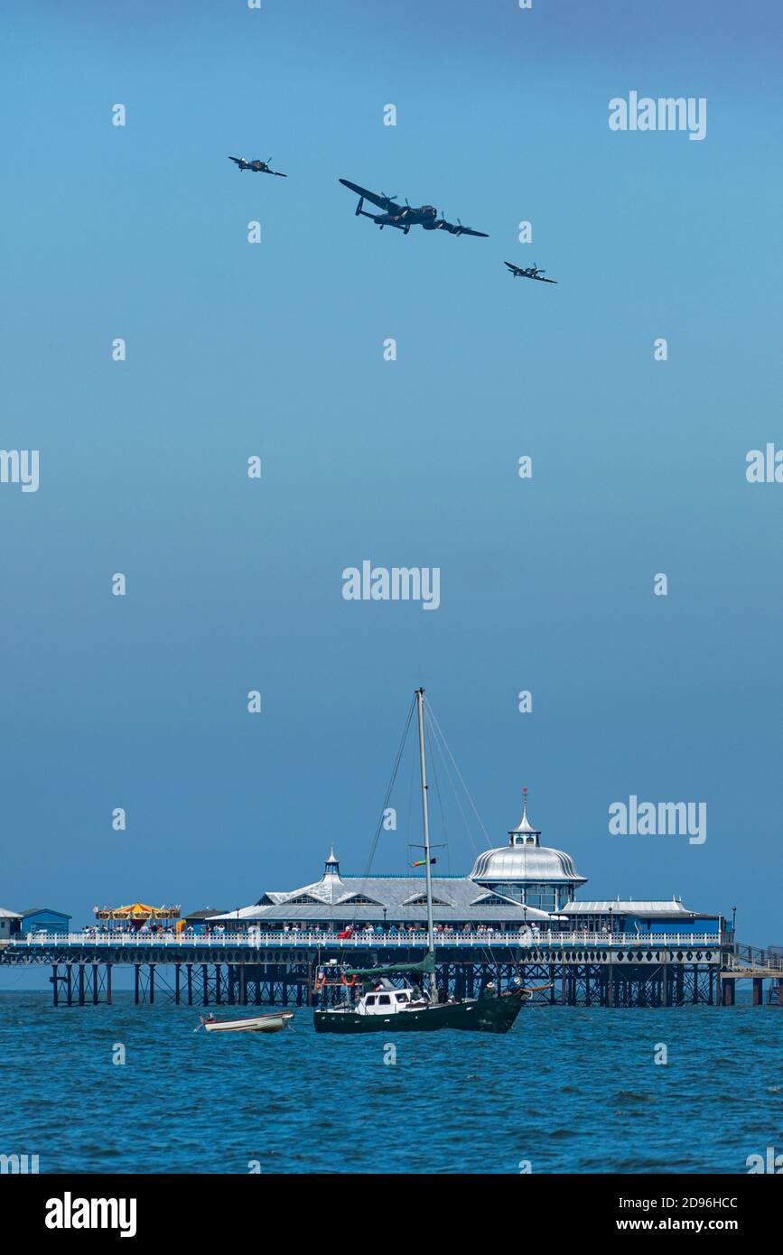 The RAF Battle of Britain Memorial Flight flies over the end of Llandudno Pier on Armed Forces Day Stock Photo