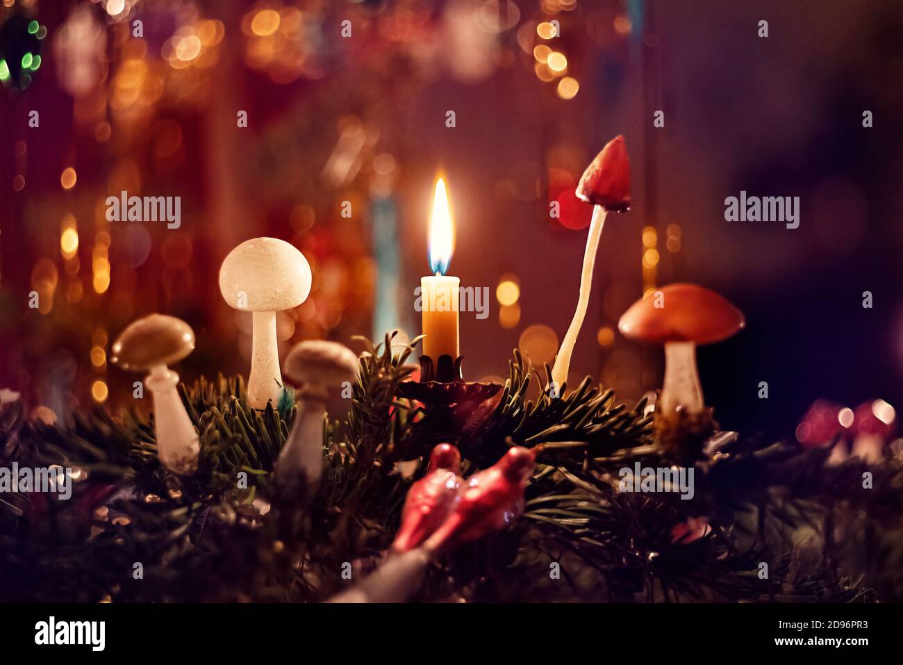 A detail of a classical German Christmas tree with real candles and a
