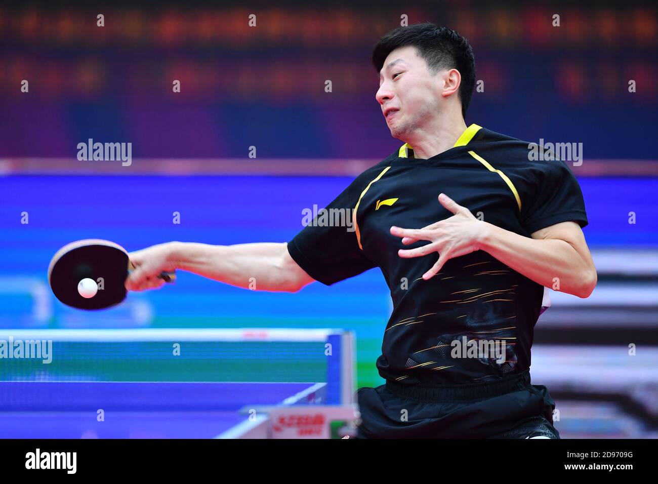 Chinese table tennis player Ma Long competes against Chinese table tennis player Fan Zhendong at the final of 2020 China National Table Tennis Championships, Weihai city, east China’s Shandong province, 10 October 2020. Stock Photo