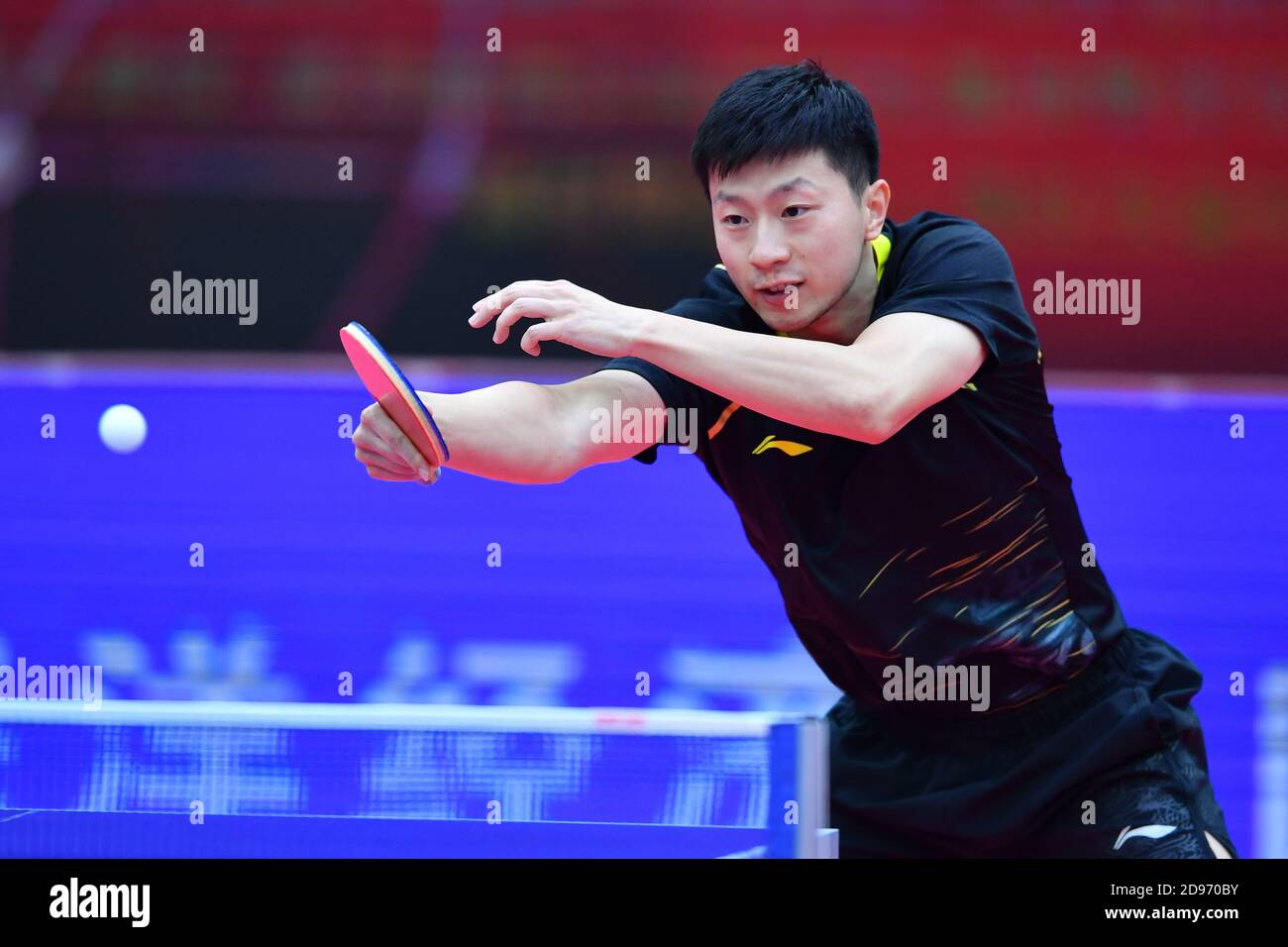 Chinese table tennis player Ma Long competes against Chinese table tennis player Fan Zhendong at the final of 2020 China National Table Tennis Championships, Weihai city, east China’s Shandong province, 10 October 2020. Stock Photo