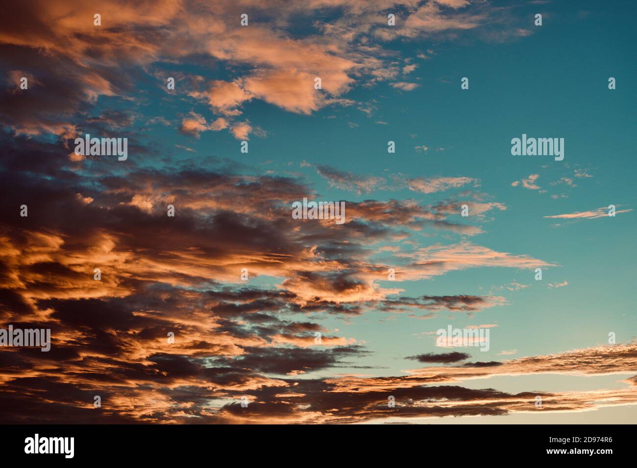 Blue sky with dramatic orange cloud formation Stock Photo