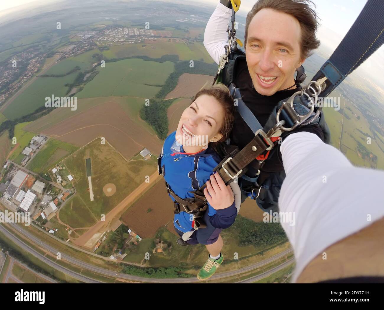 Selfie tandem skydiving with pretty woman Stock Photo