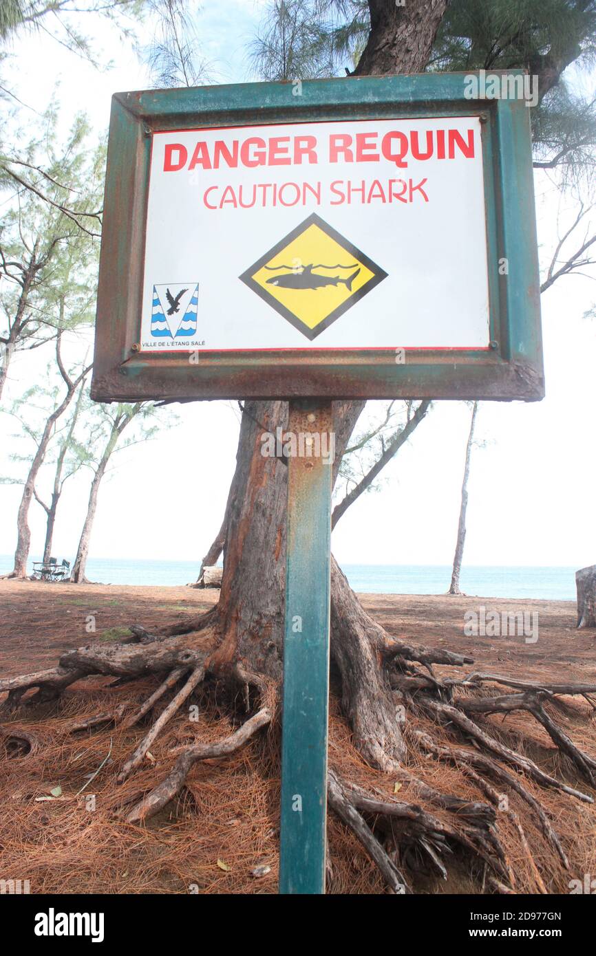 Warning sign against sharks in Reunion. Stock Photo