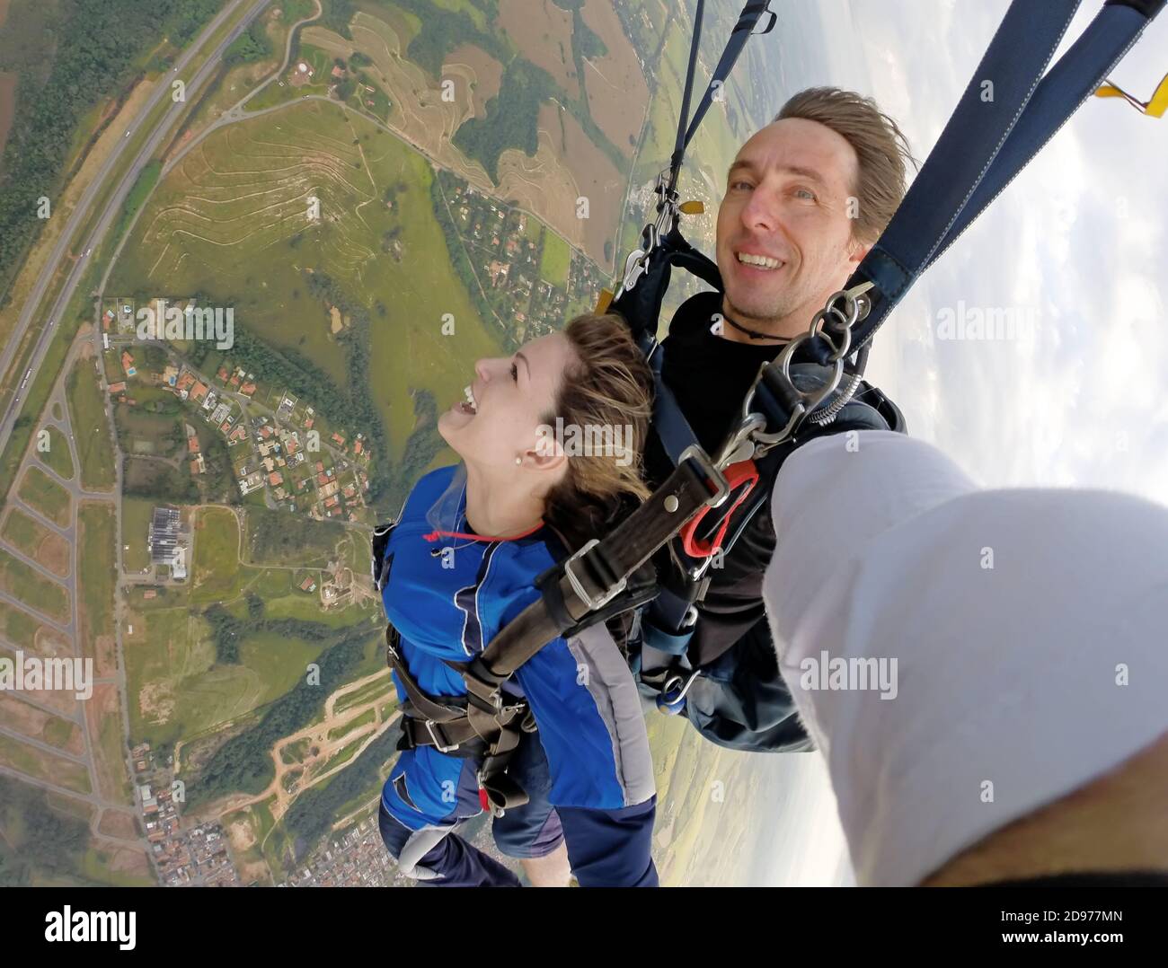 Selfie tandem skydiving with pretty woman Stock Photo