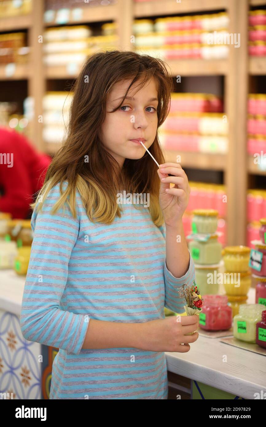 Girl in store tastes hi-res stock photography and images - Alamy