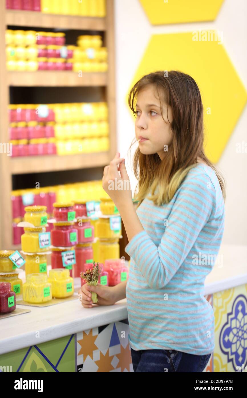 Girl in store tastes hi-res stock photography and images - Alamy