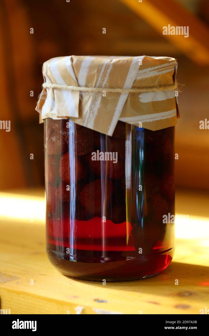 Strawberry and cherry jam on a wooden shelf Stock Photo Alamy
