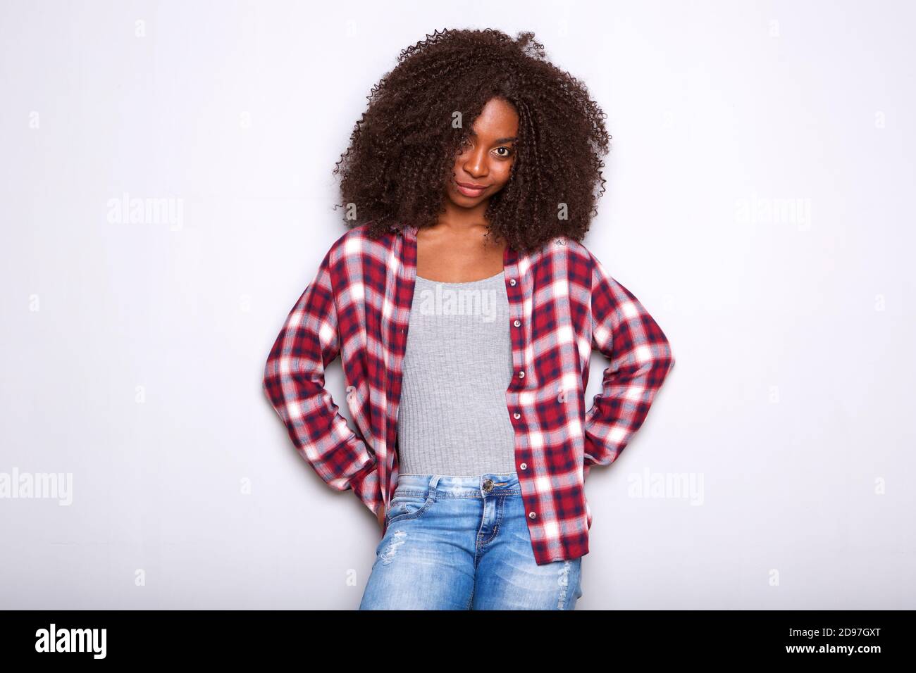 Portrait of fashionable young african american woman posing on white ...