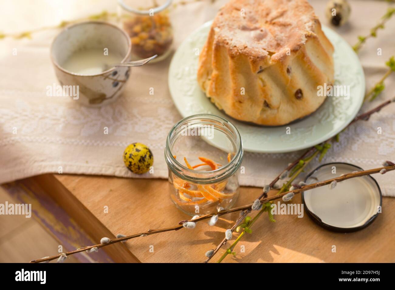 Polish Easter babka yeast cake. Glazing traditional baba raisin bread Stock Photo