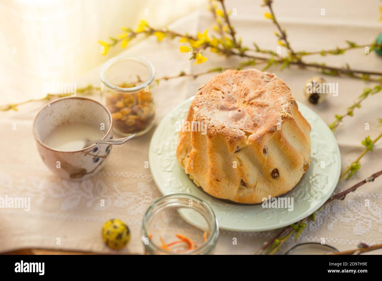 Polish Easter babka yeast cake. Glazing traditional baba raisin bread Stock Photo