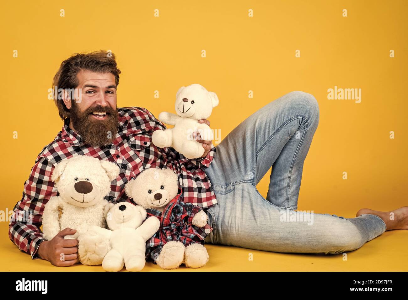 good mood. Birthday holiday party celebration. feel happiness. Man with beard hold cute toy bear. Man holds teddy bear. Gifts and holidays concept. This is for you. hipster like animal toy. Stock Photo