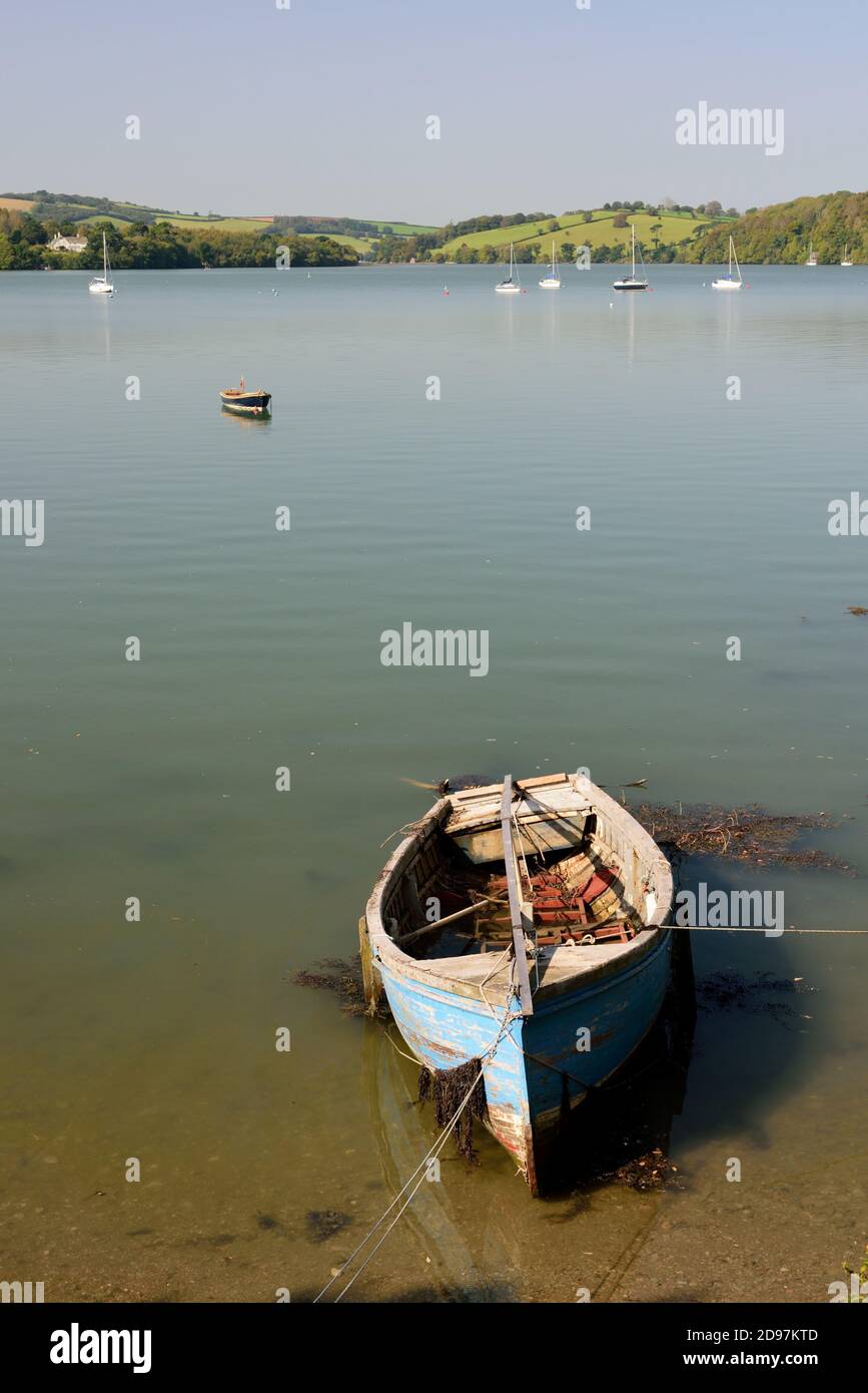 An old boat moored on the river Dart at Galmpton Creek. Stock Photo