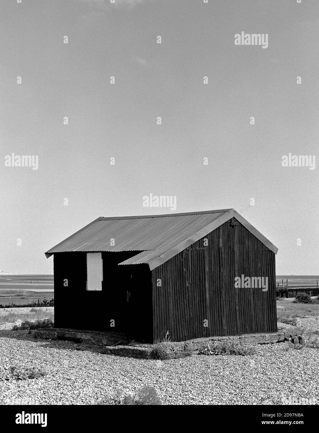 Black Tin Hut On Beach Stock Photo
