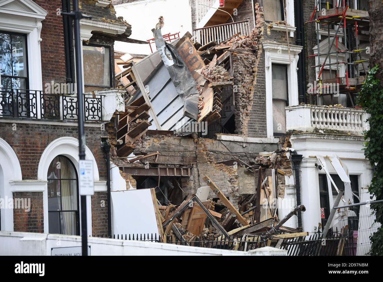 The scene in Durham Place in Chelsea, west London, after two mid-terrace houses collapsed. The two properties, which were undergoing renovation work, collapsed late on Monday evening, causing emergency services to evacuate nearby homes. Nobody was thought to be hurt, according to the London Fire Brigade. Stock Photo